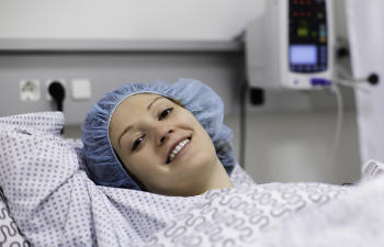 A satisfied female patient after surgery.