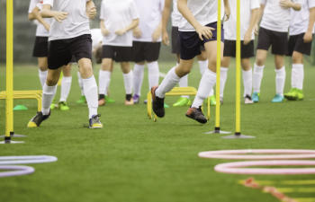 Child athletes during warm up before the training.