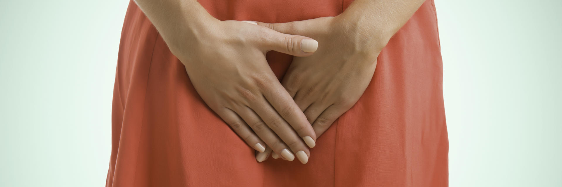 a woman is covering her perine with her hands, pain related to Pudendal Neuralgia